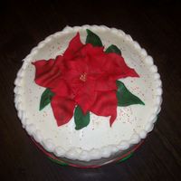 Pointsetta quickie cake for my cousin's christmas party...red velvet with creamcheese frosting, fondant pointsetta