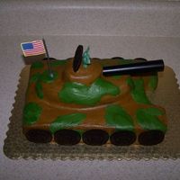 Army Tank Cake Side view of cake. Wheels were oreos and the icing is buttercream. I made a cake in a 9 X 13 X 2 pan and cut it to size. I had a small...