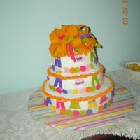 Sara's Baby Shower Cake Fondant bow in girly colors & fondant clothes. The rest of the cake was buttercream