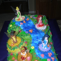 Tinkerbell Cake Lots of fun ;easy lemon cake w/ buttercream frosting & all kinds of flowers