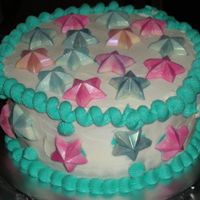 Jessi's Birthday a cake for my sister's birthday. chocolate stars that had been dusted with pearl and petal dust. it was cream cheese icing over...