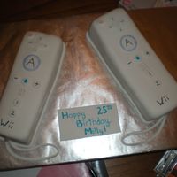 Wii Remotes two Wii remotes for a co-worker's brother. had a blast making them. they are rum cake underneath.