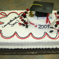 Red/black Graduation Cap buttercream with black and red fondant accents. Cap made from fondant.