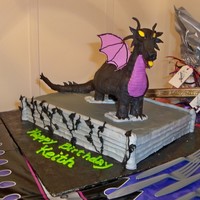 Maleficent From Sleeping Beauty Cereal treat dragon covered in modeling chocolate. I made the wings out of gumpaste.