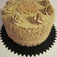 Pumpkin Toffee Cake Pumpkin cake with toffee cream filling and caramel buttercream frosting.