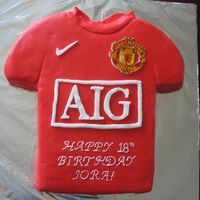 Manchester United Jersey made with fondant. Crest was rice paper painted and applied to thin fondant. The birthday boy loved this cake,