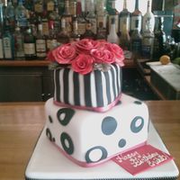 Erika's Birthday Cake Devil's food with chocolate and peanut buttercream. Covered with fondant and roses are made from gumpaste.