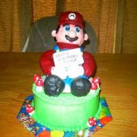 Super Mario Wasc. Buttercream and fondant on Mario and mushrooms.