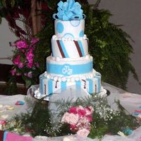 Blue, Brown, And White Wedding Cake The bride and I pulled together 4 different tiers from 4 different cakes that she liked. It is buttercream with fondant accents.