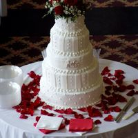 All White Buttercream Wedding Cake With Fondant Accents All white buttercream -- first time using hi-ratio shortening and loved it!!! With fondant accents for decoration with luster dust on...