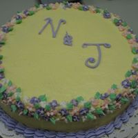 Annivesary Cakes Coconut Cake with Buttercream and Royal Flowers.