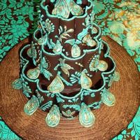 Chocolate Paisley coconut cake covered with chocolate ganache. decorated with chocolate candy melts that were melted and shaped on flower formers.