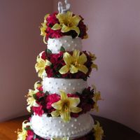 Tropical Flowers this was a 10", 8", and 6" cakes all wasc with buttercream and silk flowers