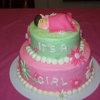 Daisy Baby Shower 9 and 6 inch buttercream, with fondant accents and plastic baby.