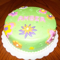 Flowers buttercream with marshmellow fondant flowers and name, inspiration from cakesbyallison's beading party cake.