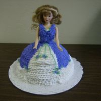 My First Doll Cake. This was a real cool cake to make, the best part is that i shaved the cake myself, it was actually a square cake, i didn't have time...