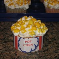 Popcorn Cupcake Popcorn cupcake made for my son's daycare. The marshmallows were cut in half and stuck back together. Then they were stuck on the iced...