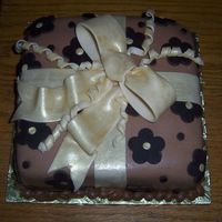 Chocolate Present Cake This cake is a chocolate cake with a chocolate creme brulee ganache filling, chocolate creme brulee bc, and covered in chocolate...