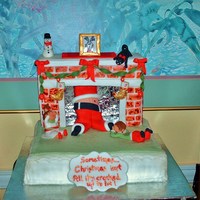 Sometimes Christmas Isn't All It's Cracked Up To Be rich rum fruitcake covered with fondant. all figures fondant/gumpaste mixture.