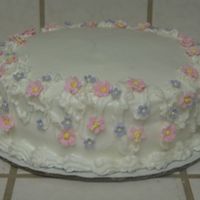 Mom's Birthday Cake This is a blueberry cake with Cream cheese/Buttercream frosting. It was my first attempt at gum paste flowers.