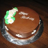 Chocolate Bday Cake Golden Butter Cake with Bavarian Chocolate filling and Chocolate buttercream. Flowers were left over from a Royal Icing flower class (so...