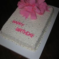 Pink Bow Birthday vanilla cake, bc frosting with cornelli lace, fondant bow, silver dragees.