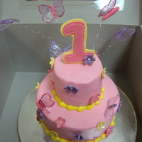 1St Birthday Light pink buttercream cake, 6" and 3" cake with gelatin butterflies and gumpaste topper and flowers!! It was really fun to make...