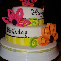 Quilled Flower Birthday Cake This was my first attempt and a quilled flower. Topper and flowers are made with gumpaste and it was really fun to make!! TFL