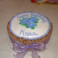 25Th Birthday This is a devils food cake with whipped chocolate ganache filling and pirrouette cookies on outside of cake.