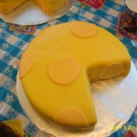 Two Cheese Wheels This is one of the cheese wheels that went with Remy for Aaron's Birthday. One Stawberry and the other chocolate. Both have wedges cut...