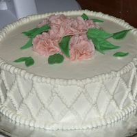 Gum Paste Flowers First gum paste flowers. The cake is a strawberry cake with srawberry filling.