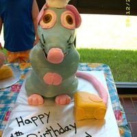 Remy For Aaron 4Th Remy is Chocolate cake with cream cheese frosting. He is stacked, carved and covered with fondant.