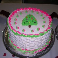 Christmas Cake I made this cake in a bit of a hurry for a church gathering. I was hoping to make the piping green and red but it turned out pink instead...