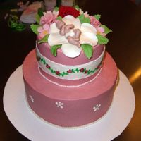 Baby Shower Cake With Candy Clay Decorations Covered in buttercream icing. The vine border is supposed to match a sample they gave me for the babies room. I painted the vine using...
