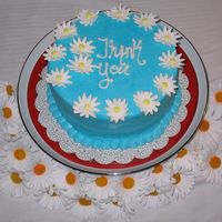 Daisy "thank You" Cake This was a last minute cake I did for our realtor for being so nice to us. It turned out darker than I wanted. You know how buttercream can...