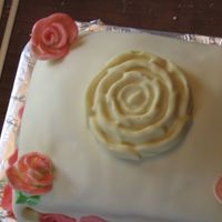 Rose Birthday Cake First attempt at MMF and Decorating! I know I can do betterMy wife likes it so I think I will call it a success for now.