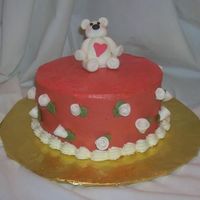 Bear Valentine This is an Italian Cream cake with buttercream icing. Fondant bear and flowers.