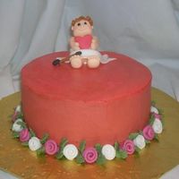 Cupid Valentines Pink Champagne cake with buttercream frosting. Fondant cupid and flowers
