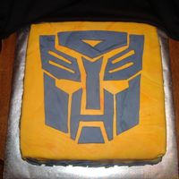 Transformer 10inch square devilsfood 2 layer bc then "fire pool" of fondant and fondant cut out transformer