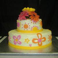 Lisa's Cake oval bc w/ fondant accents