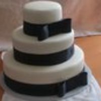 Wedding Cake Red velvet cake, cream cheese icing, Buttercream Fondarific, black satin ribbon. Used SPS which is fabulous.