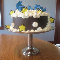 Dreaming Of Baby White Chocolate cake wrapped in chocolate fondant; fondant also used for moon, stars, and 'BABY', covered in royal icing. Puffy...