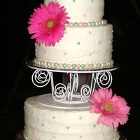 Angela's Wedding My first experience with butter cream frosting on a wedding cake. The day was humid and it bagen to melt. I was sooooo afraid it was going...