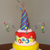 Party Cake My first attempt at a sort of Whimsical Cake. I don't think I really got the whimsy in it but oh well! It's a Red Velvet cake for...