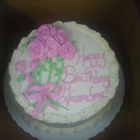 Grandma's Birthday This cake was for a girl at work. It is 2-9" Strawberry layers frosted and decorated with SMBC.