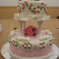 Wilton Course 3 Final Cake This is my final cake for the wilton class 3. It is a pound cake with fondant and butter cream decorations.