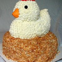 Chicken Customer wanted a "big chicken cake," so this is what she got. The "nest" is covered in toasted coconut.