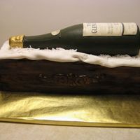 Glenlivet Scotch Triple chocolate fudge cake covered in fondant. Bottle is chocolate.