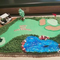 Golf Cake Cake I made for a friend who loves golf. Piping gel lake, chocolate rocks and fondant greenways.