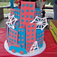 Spiderman Cake Buildings made from gumpaste, royal icing webs. I never want to do another spiderman cake again....I could not come up with anything for it...